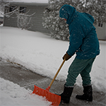 Man shoveling his sidewalk