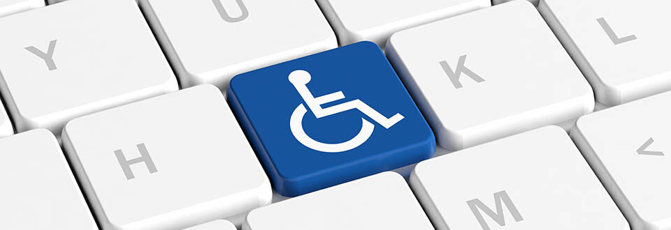 Keyboard with one of the letter keys replaced with the international wheelchair symbol for disability