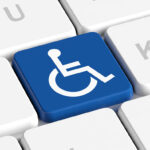 Keyboard with one of the letter keys replaced with the international wheelchair symbol for disability