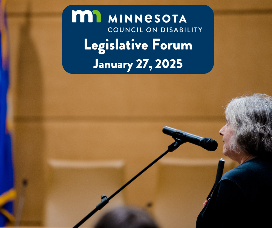 An older woman with gray hair holding a white cane speaks into a microphone at at an event. A banner top center reads: 'Minnesota Council on Disability Legislative Forum, January 27, 2025.' A Minnesota state flag is partially visible in the background.