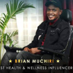 Screengrab of Brian Muchiri, seated in a power wheelchair. He wears a black jacket, a black cap, and a red turtleneck. Text on the image reads: "Brian Muchiri - Best Health & Wellness Influencer."