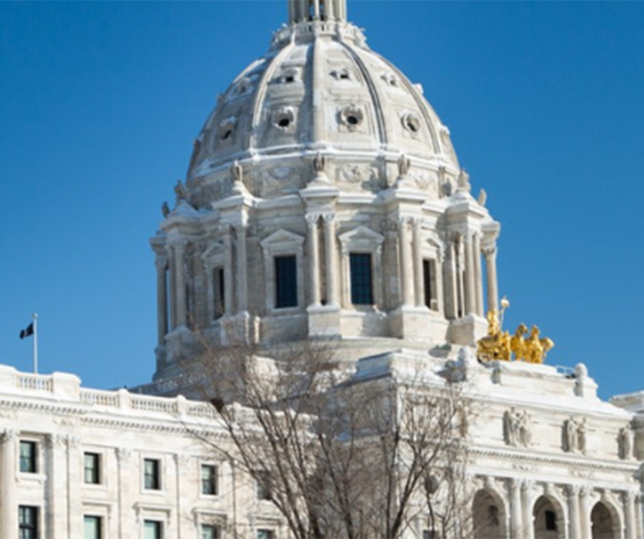 Minnesota State Capitol building with a bright blue sky in the background.